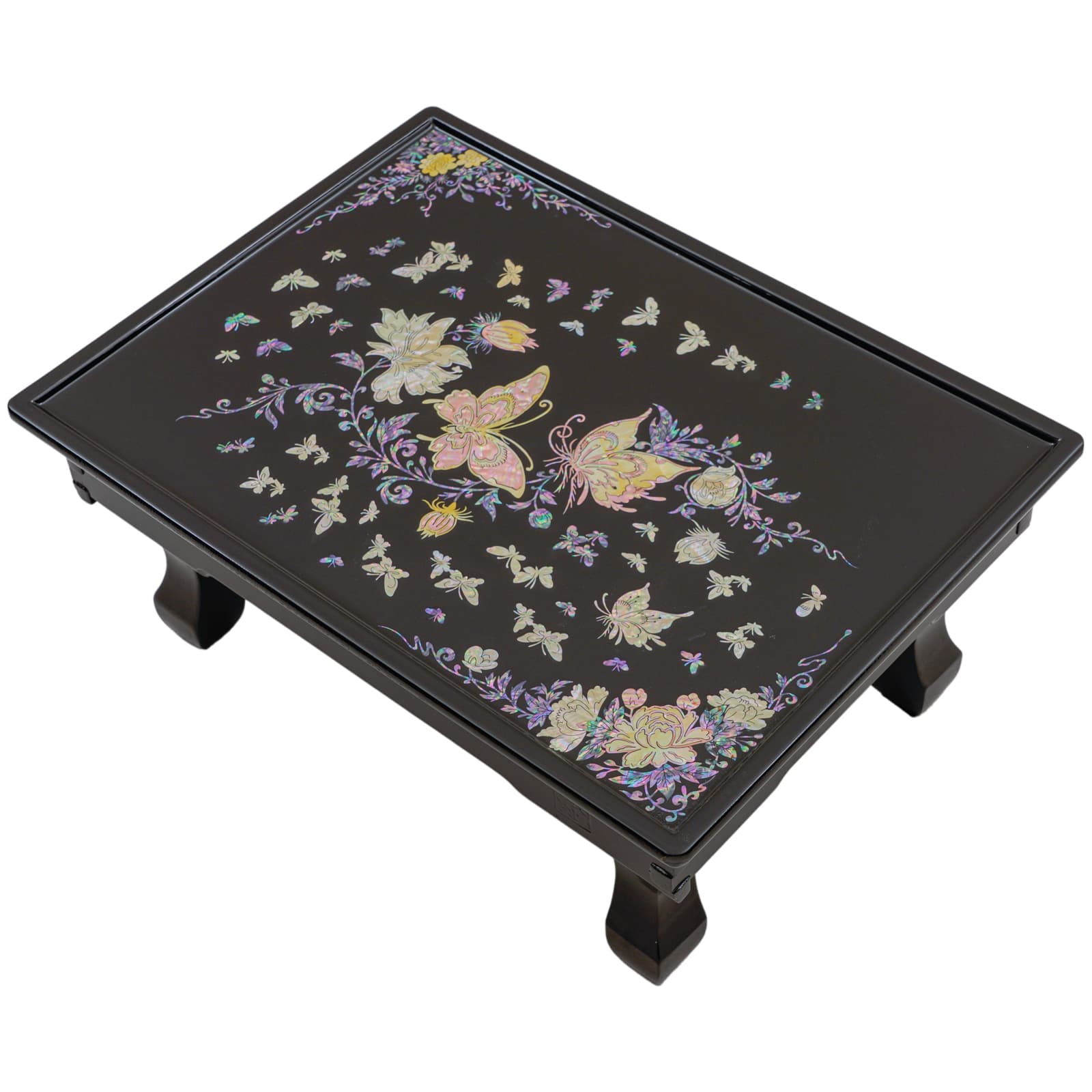 A black lacquered table with intricate mother-of-pearl inlay of butterflies and flowers on the surface.