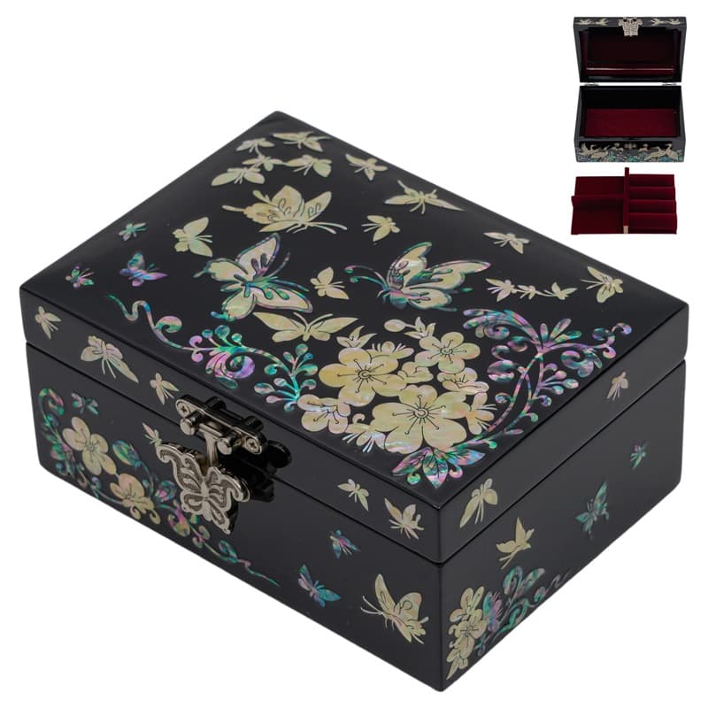 A black lacquer jewelry box adorned with mother of pearl butterfly and floral inlays, featuring a red velvet interior and removable tray.