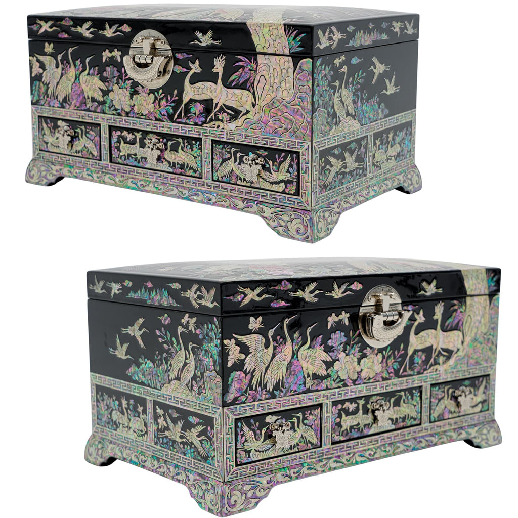A black lacquer jewelry chest with detailed mother-of-pearl inlays featuring birds, flowers, and deer. The artwork is framed by intricate borders, with a secure front latch for closure.