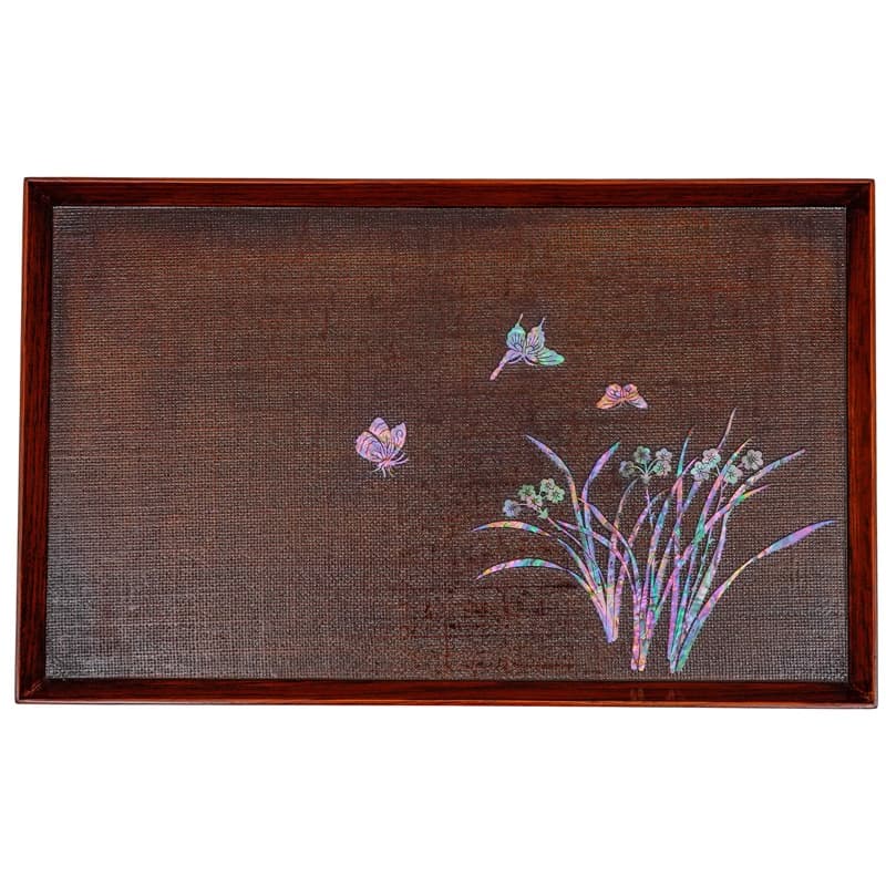 A brown hemp fabric tray with a wooden frame and mother-of-pearl inlay depicting butterflies and a floral arrangement.