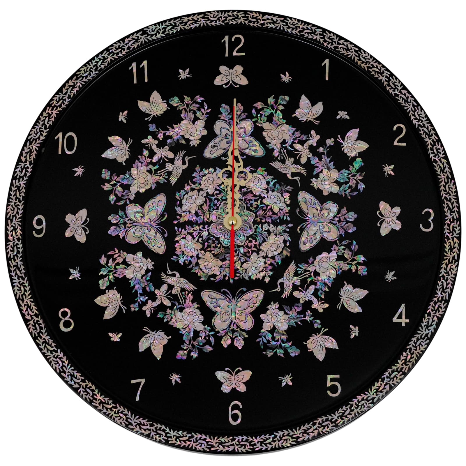 A circular wall clock adorned with iridescent Mother of Pearl patterns featuring butterflies, flowers, and other delicate designs on a black background. The clock hands are centered with numbered hours around the edge.