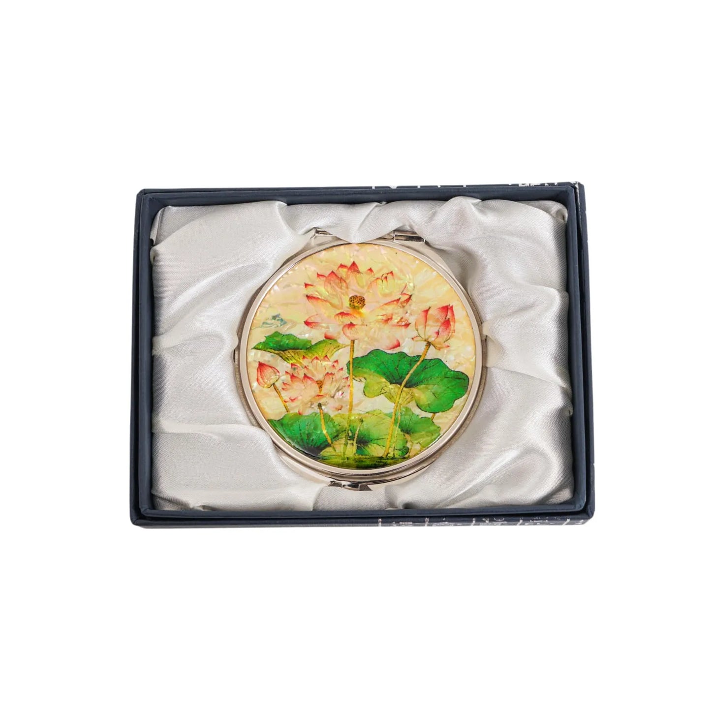 A compact mirror featuring pink lotus flowers and green leaves, nestled in a black satin-lined gift box