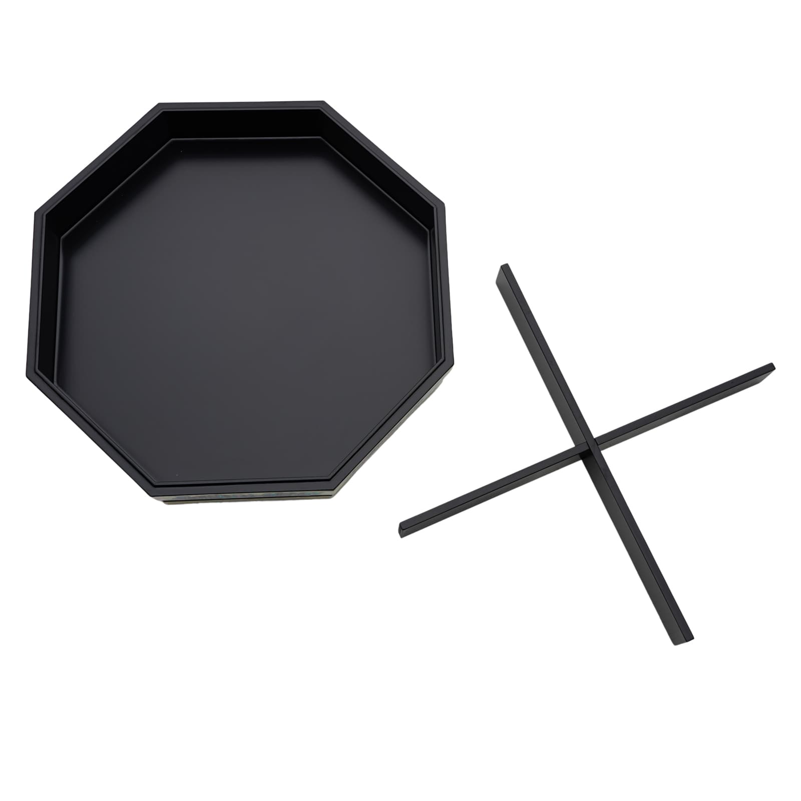 An empty octagonal black box viewed from above, with two divider inserts laid out next to it.