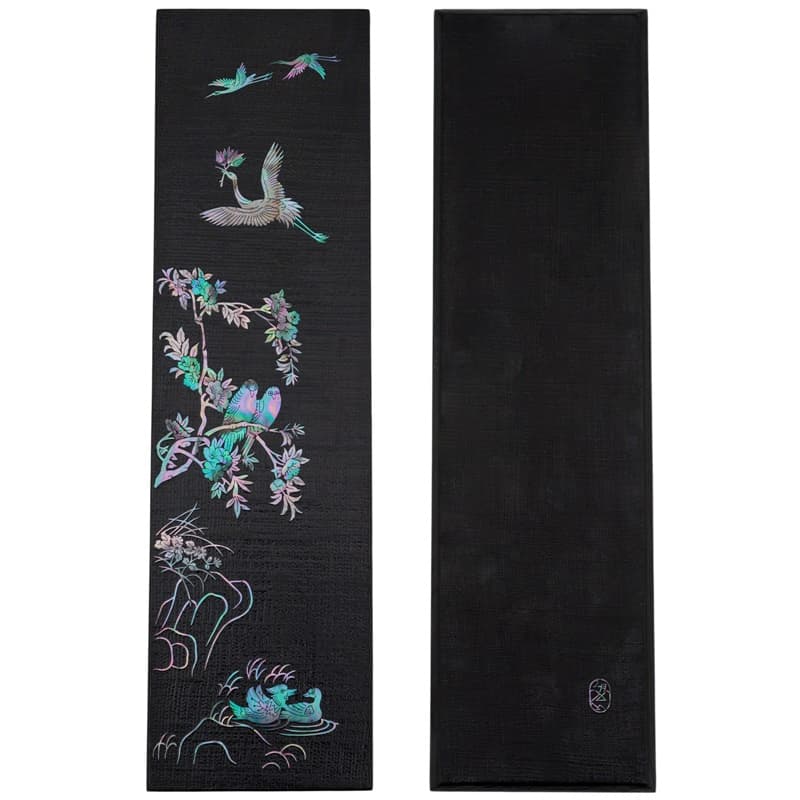 A rectangular wooden tray with hemp cloth, featuring a mother-of-pearl bird and floral design.