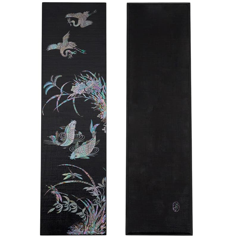 A wooden tray with hemp fabric and mother-of-pearl birds and foliage inlay.