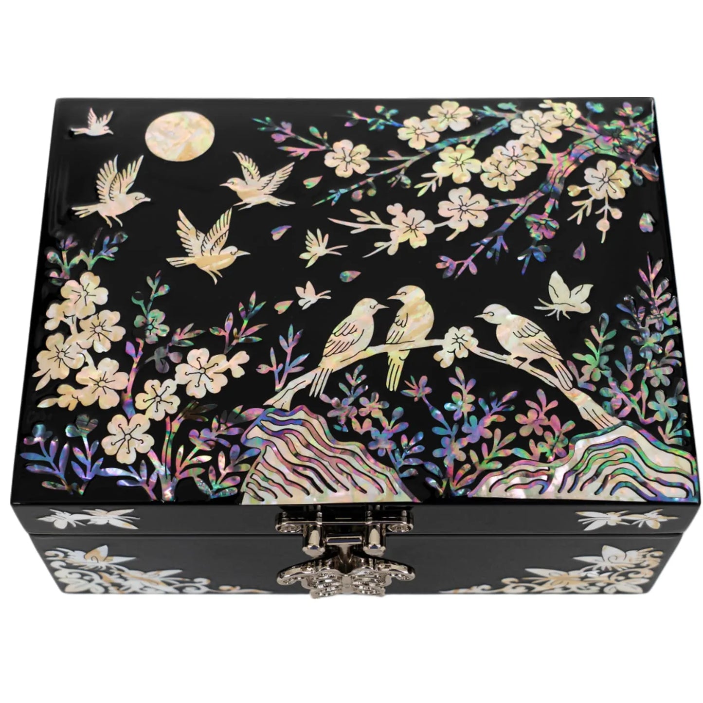 Black jewelry box with iridescent bird and blossom inlay under moonlight
