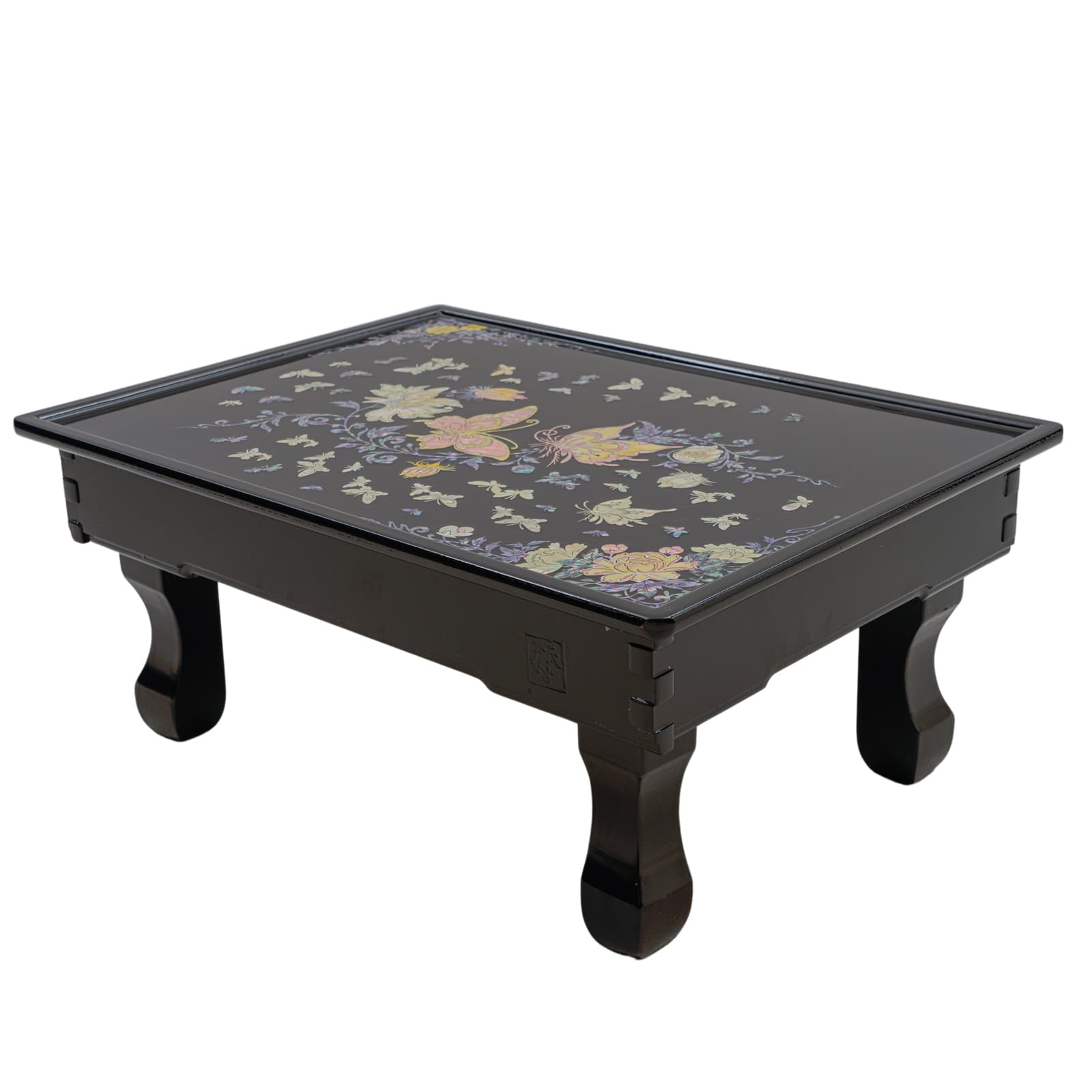 Black lacquered tray with colorful floral and butterfly inlay design, supported by four elegant legs.