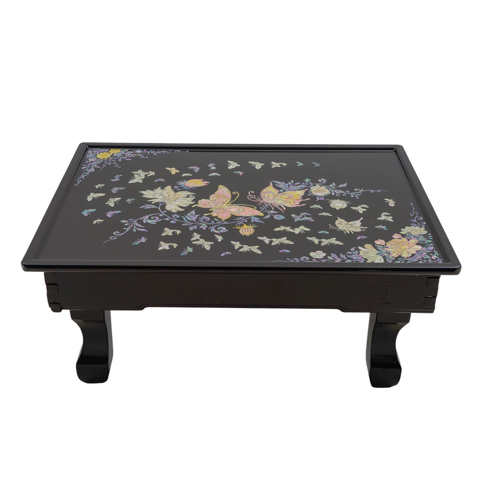 Black rectangular tray with colorful floral and butterfly design, placed on four short legs.