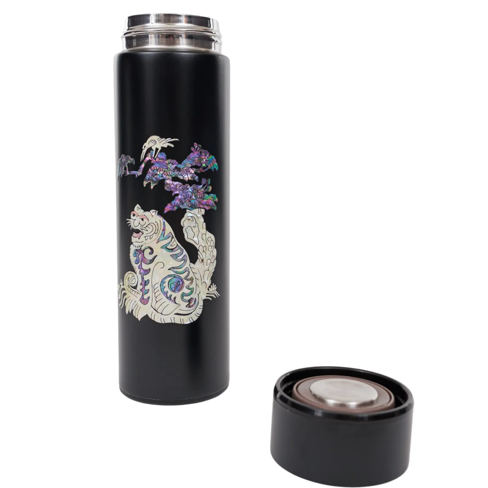 Black tumbler with mother-of-pearl tiger and pine, lid removed beside it