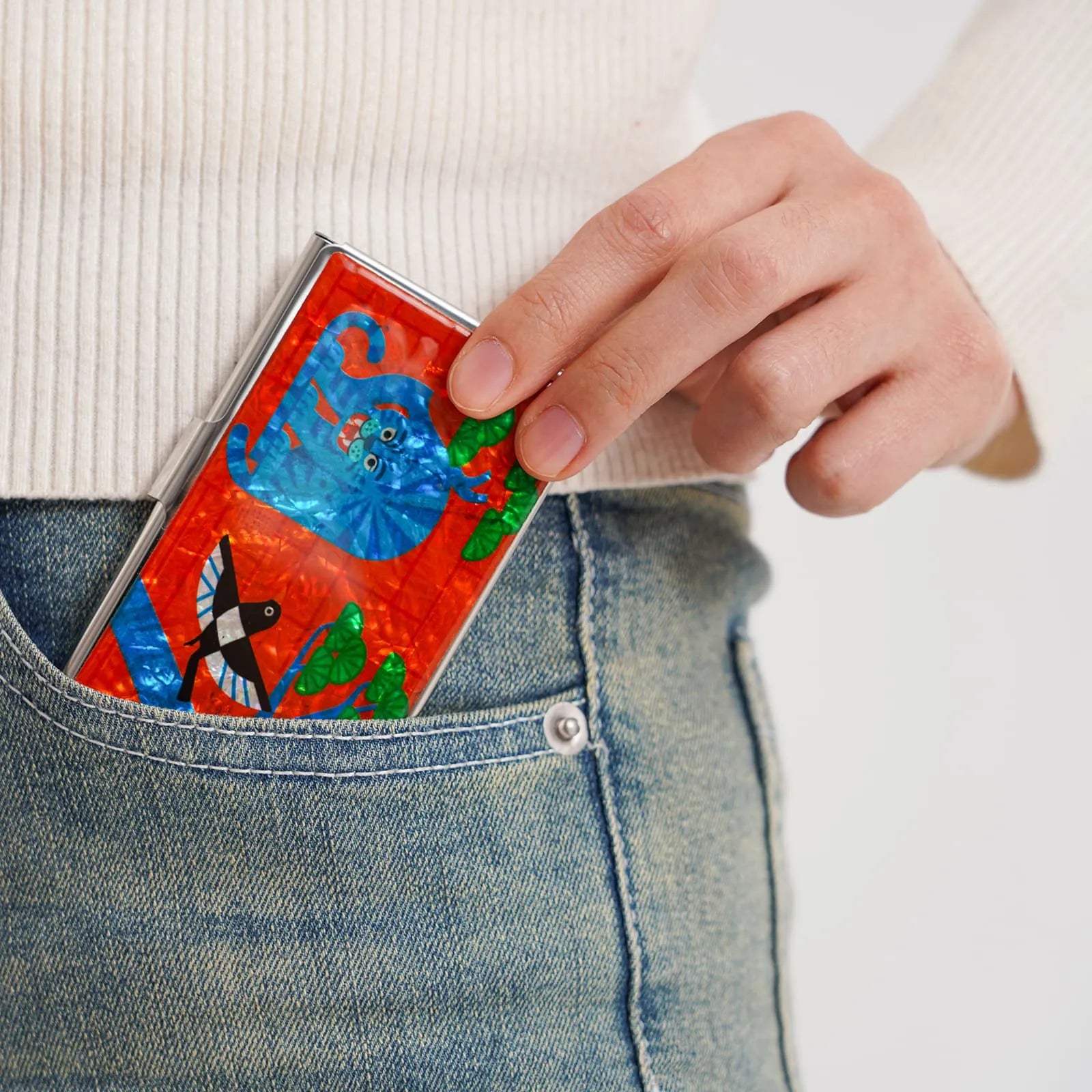 Colorful card holder featuring a blue tiger and bird design, fits easily in hand or pocket
