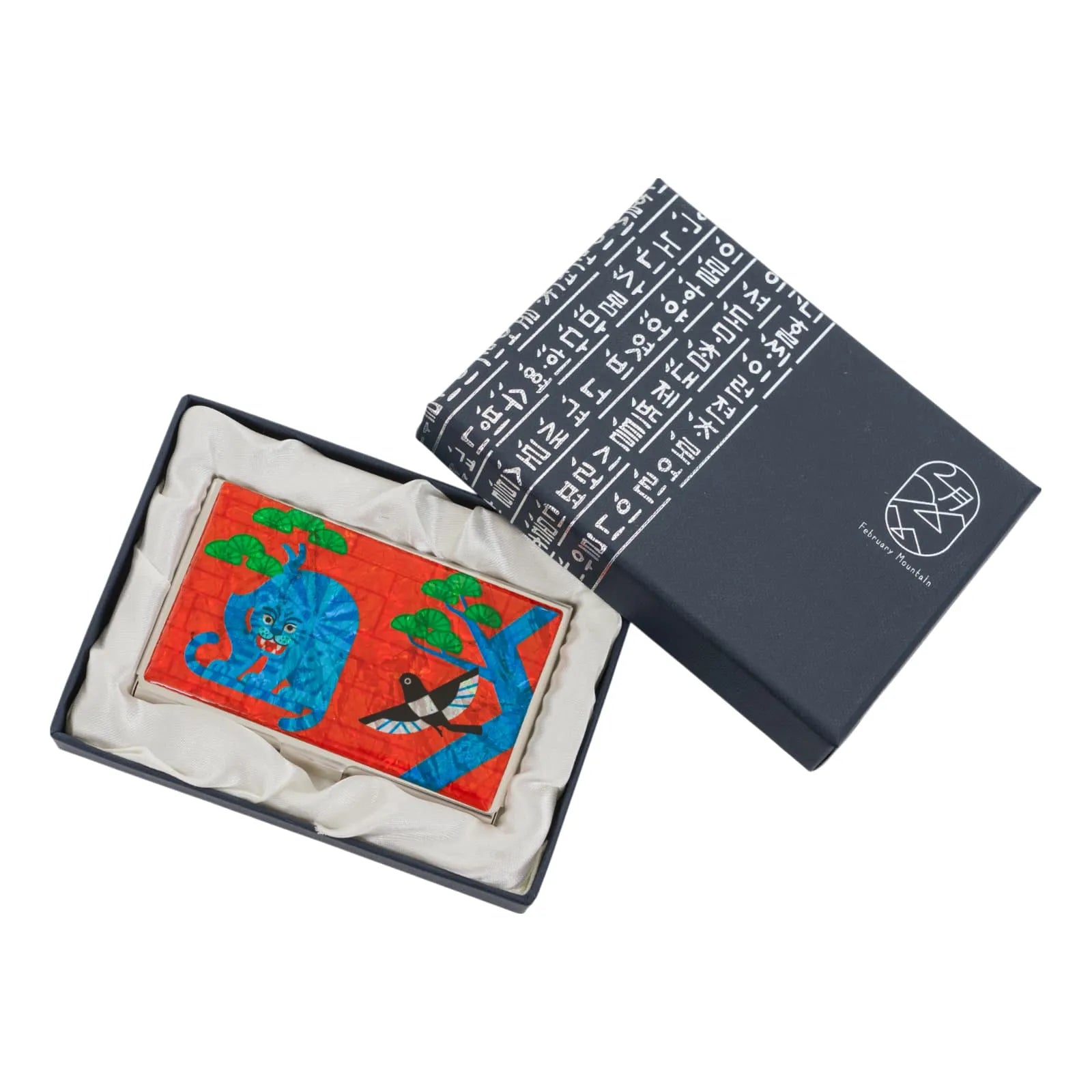 Decorative case with tiger and bird design, displayed in box with Korean text lid