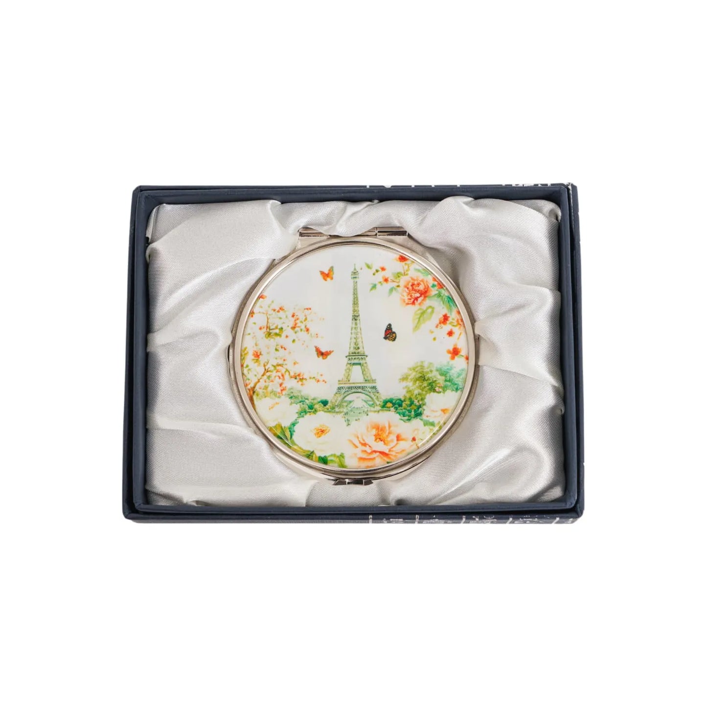 Elegant compact mirror featuring Eiffel Tower, butterflies, and flowers, nestled in a satin-lined gift box