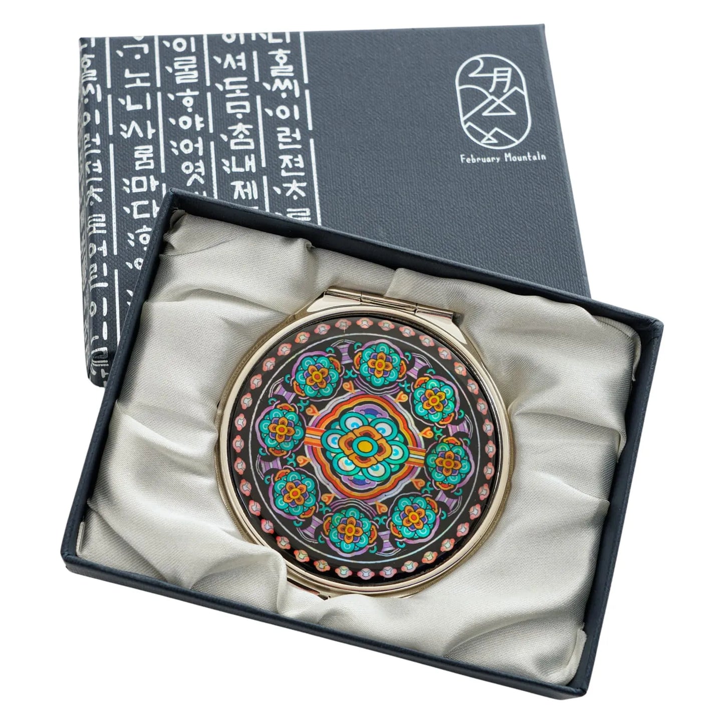 Elegant compact mirror with a vibrant traditional floral design, presented in a luxury February Mountain box