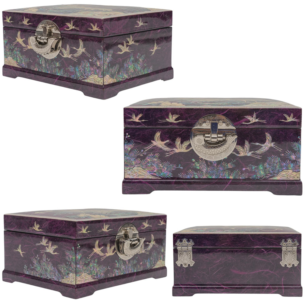 Four mother-of-pearl inlaid boxes with intricate crane and floral patterns, displayed from various angles, each featuring a metallic latch, with one box adorned with distinctive corner pr