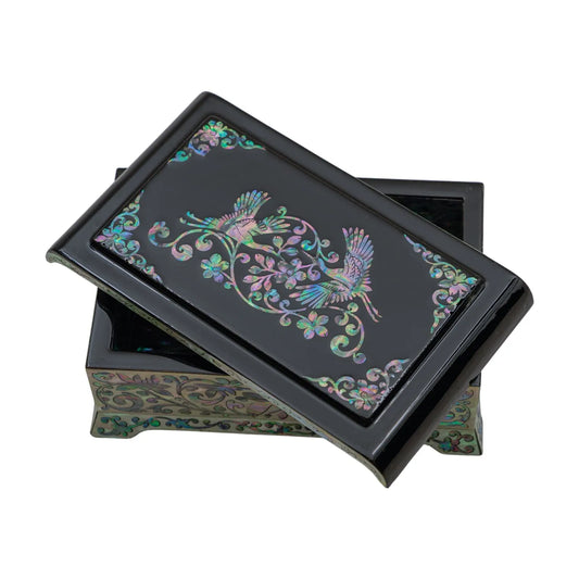 Lacquered box with cranes and floral mother-of-pearl inlay on black lid, slightly opened