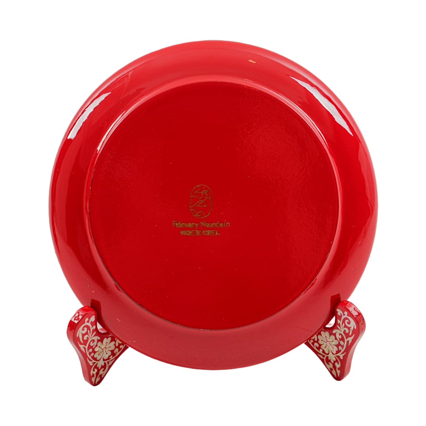 Red plate with a glossy finish, showing the back with a gold "February Mountain" logo and stand.