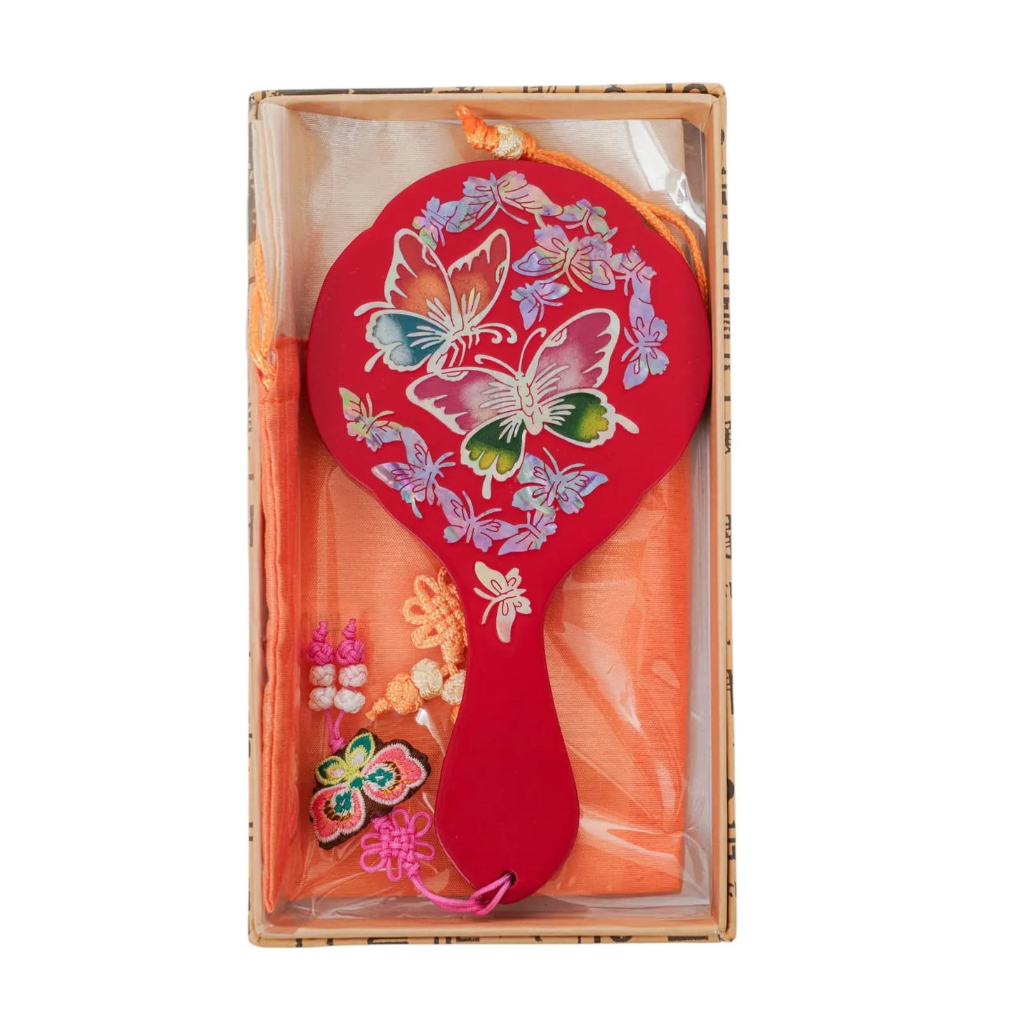 Red hand mirror with colorful mother-of-pearl butterflies in gift box with orange pouch