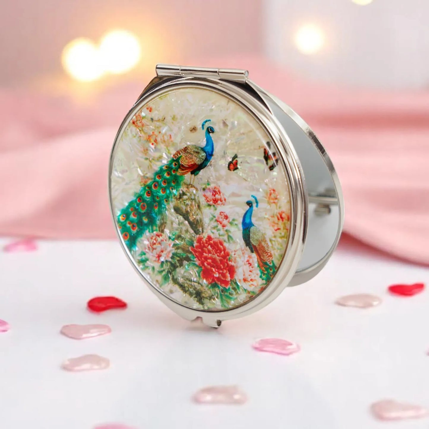 Round compact mirror with peacock and floral design on mother-of-pearl background