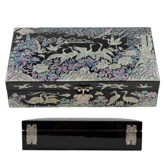 Side-angled shot of a black lacquer box showcasing the reflective glossy finish and traditional iridescent mother-of-pearl crane inlays