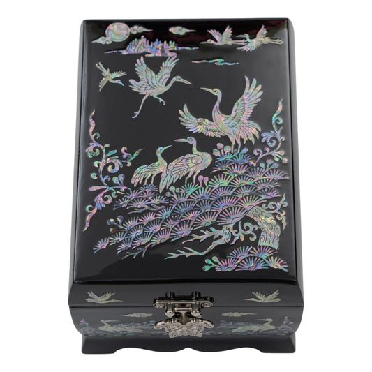 The black lacquer box with shimmering mother-of-pearl inlays depicting traditional Korean cranes, pine trees, and a full moon.