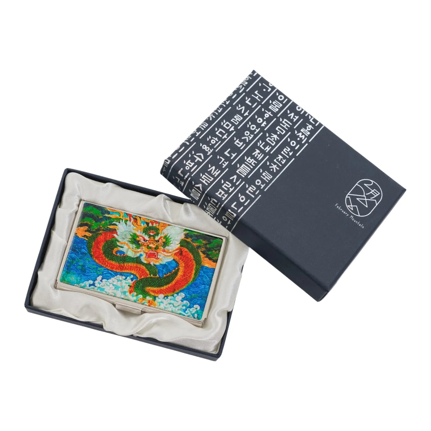 Top view of dragon card case resting in elegant satin-lined gift box
