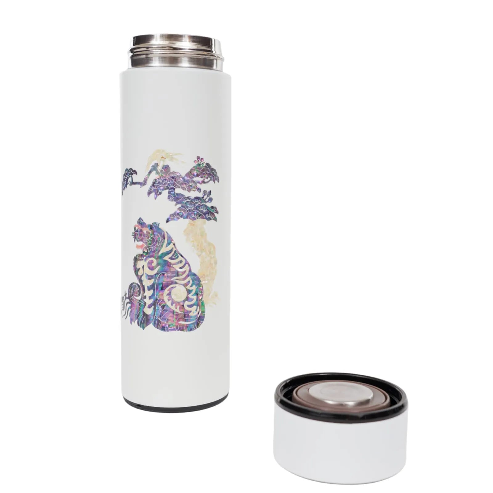 White tumbler with tiger design, cap removed and placed beside it