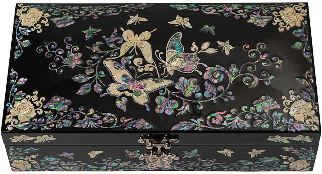 A black lacquered jewelry box adorned with a radiant butterfly and floral mother-of-pearl inlay, featuring sophisticated red velvet lining inside for an elegant storage solution.