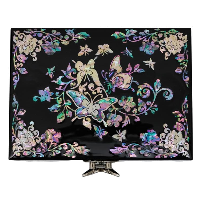 A black jewelry box with a colorful mother-of-pearl butterfly and floral design on the lid and a front clasp.