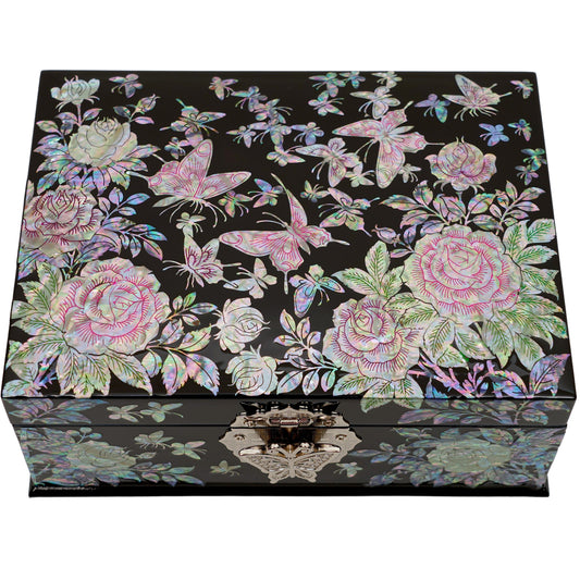A black lacquered jewelry box with mother of pearl inlay featuring pink roses and butterflies on the lid and a reflective marbled design on the front.