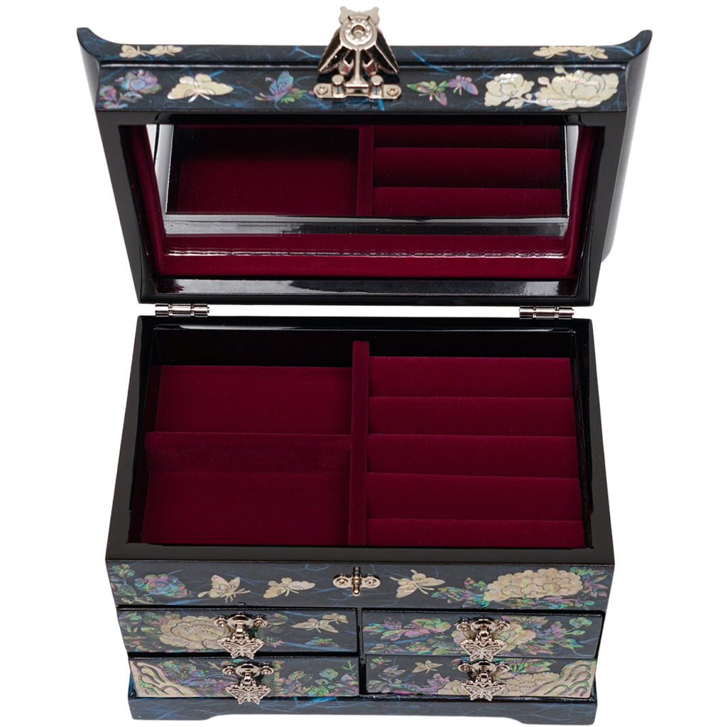 An open mother-of-pearl inlaid jewelry box with plush red velvet lining and a mirrored lid.