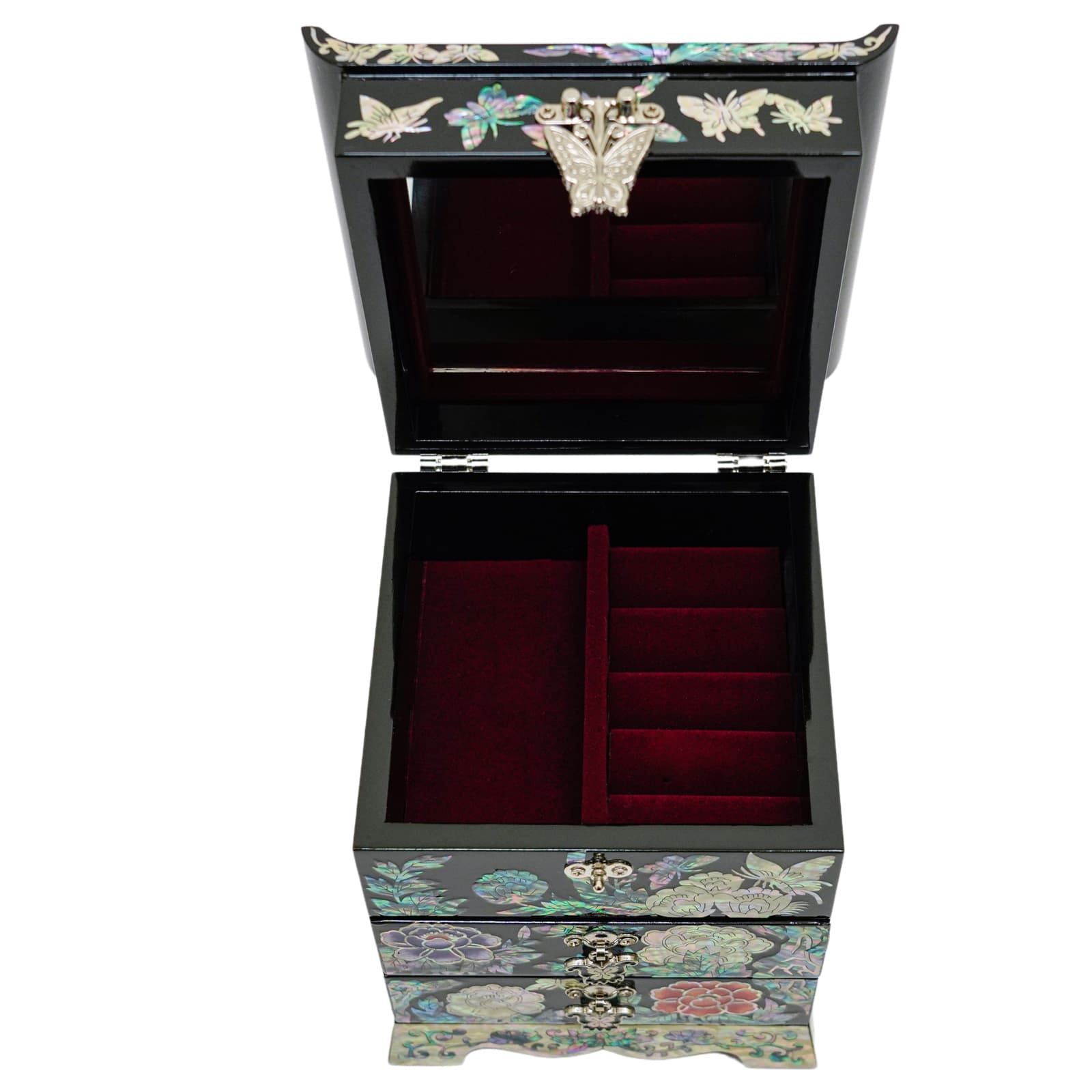 A jewelry box with an open lid revealing a built-in mirror and velvet-lined compartments for rings, with a mother-of-pearl exterior.