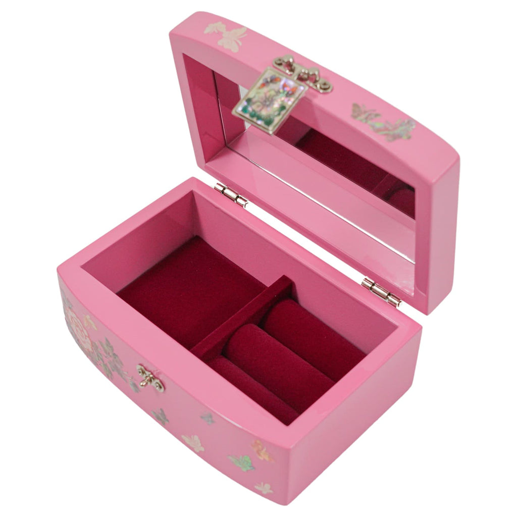  A vibrant pink jewelry box adorned with delicate butterfly and floral motifs. The hinged lid opens to reveal a mirror inset and a red velvet-lined interior, partitioned for organizing trinkets. The box also features a lustrous Mother of Pearl clasp and silver hinges.