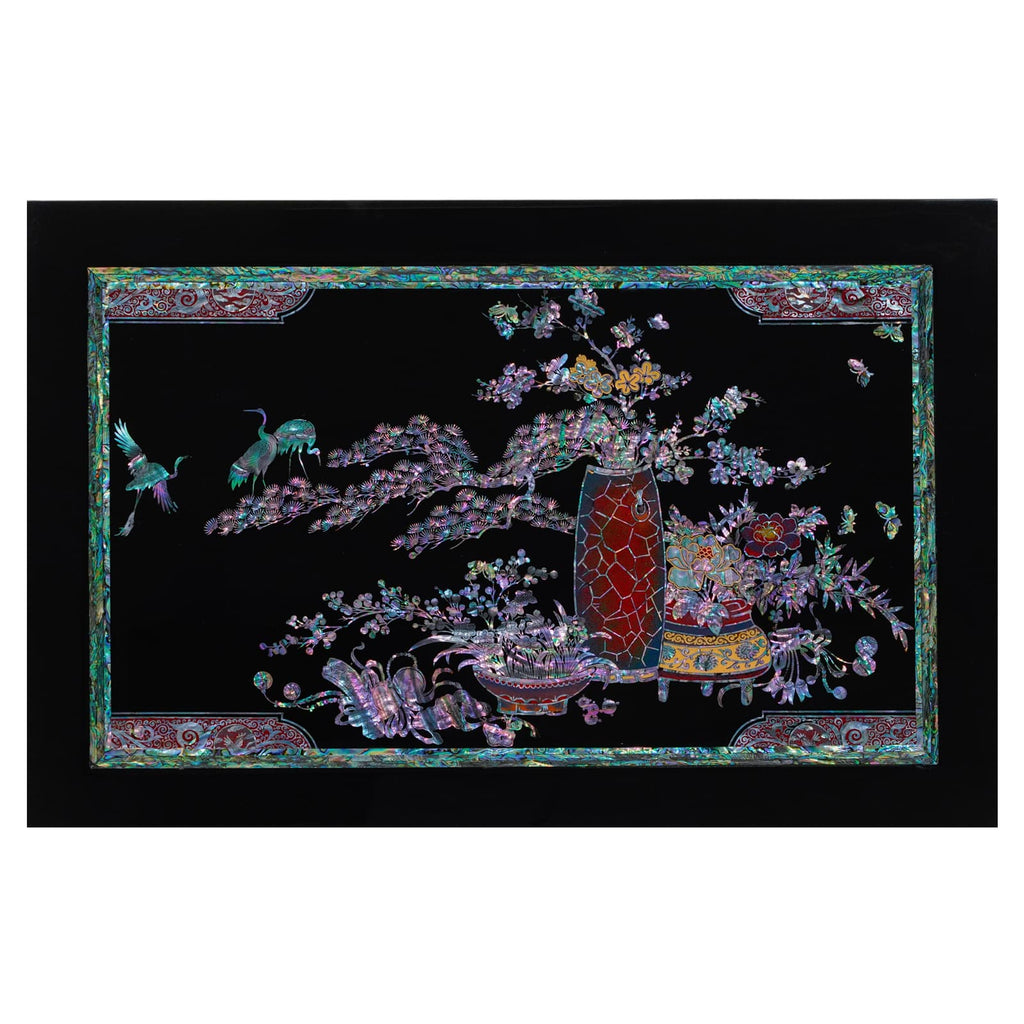 Korean Mother of Pearl wall art showcases a radiant red vase and teal birds amidst blossoming purple-pink branches. Framed by intricate teal and red borders, this piece embodies traditional Korean craftsmanship.