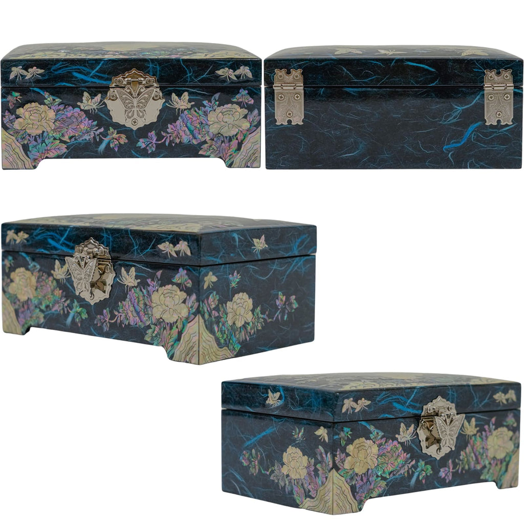 A blue jewelry box with mother-of-pearl inlay, featuring floral and butterfly designs, and distinct metal clasp and corner details.