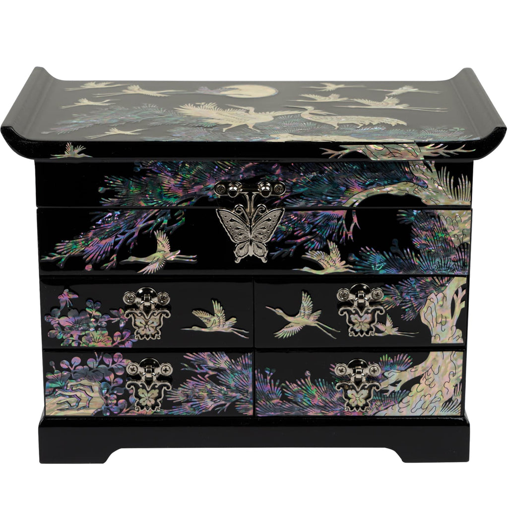 A black lacquered jewelry box with mother-of-pearl crane motifs, brass hardware, and multiple drawers for storage.