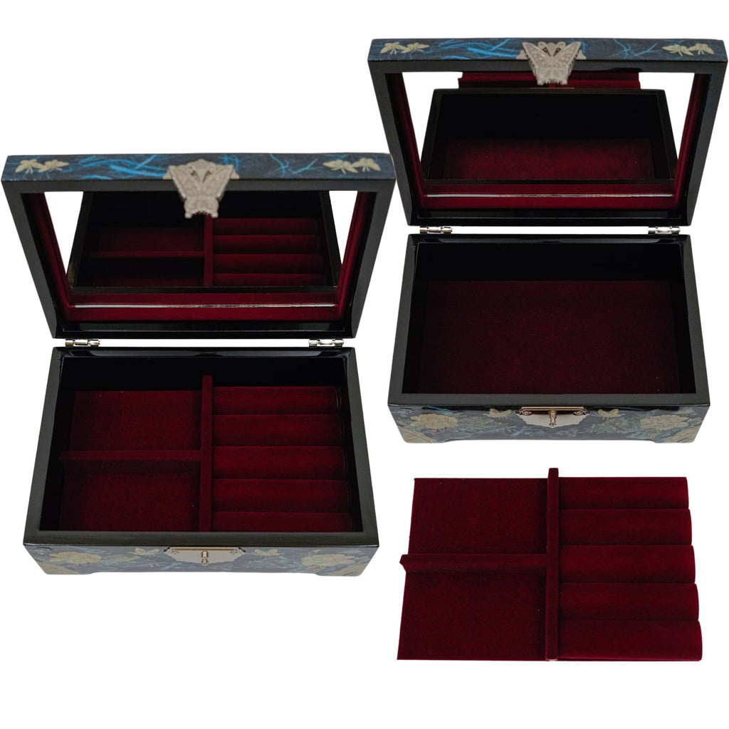 A blue jewelry box with mother-of-pearl inlay, open to reveal a red velvet interior with compartments, and a butterfly motif on the clasp.