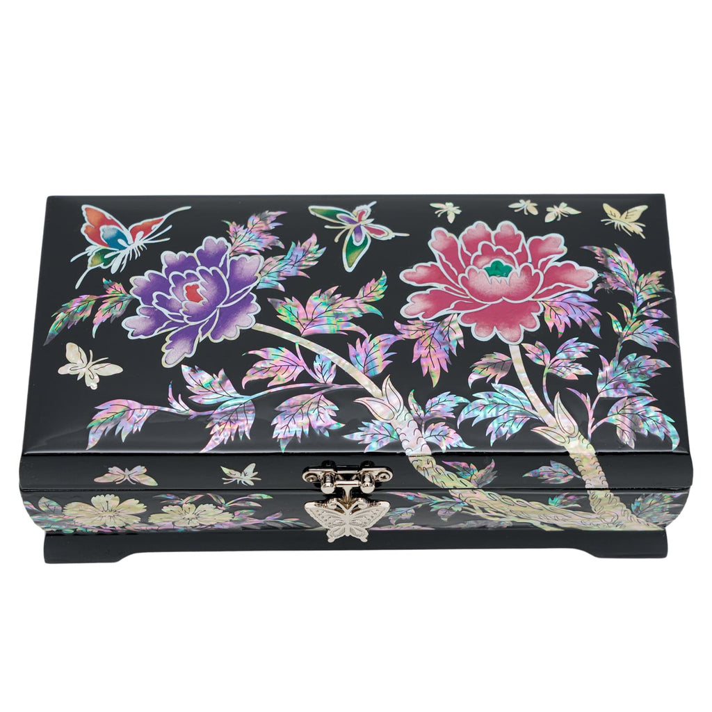A decorative black jewelry box featuring intricate mother-of-pearl inlays with flowers, butterflies, and a front clasp.