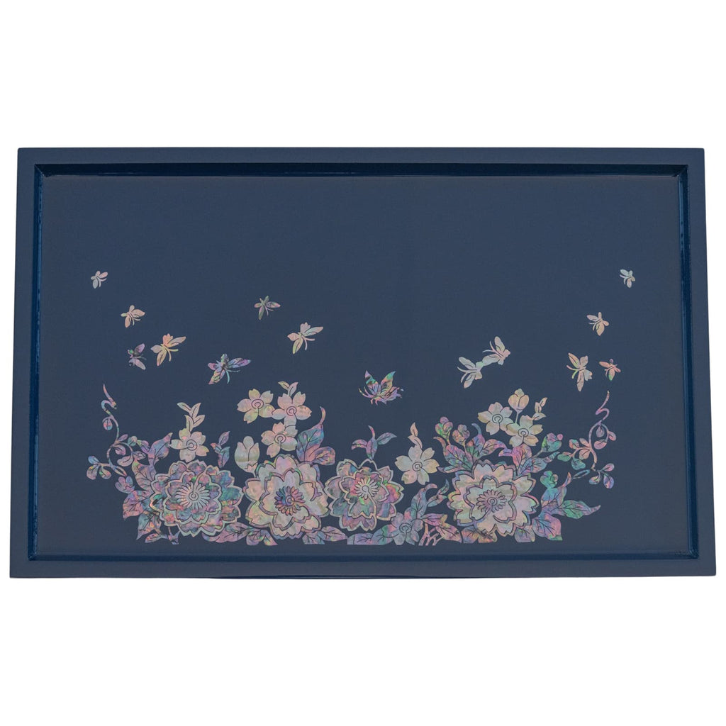 A decorative tray with a dark blue background featuring a Mother of Pearl inlay design of flowers and butterflies, bordered with a thin blue frame.