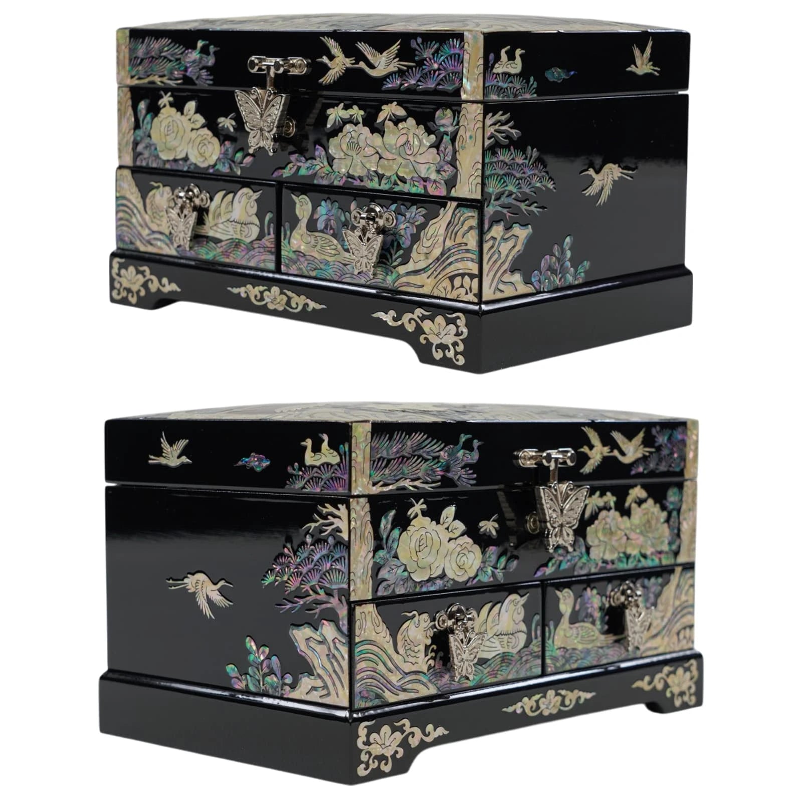 A frontal three-quarter perspective of a black mother of pearl chest, highlighting its traditional floral and bird inlays, including cranes on the side panel.