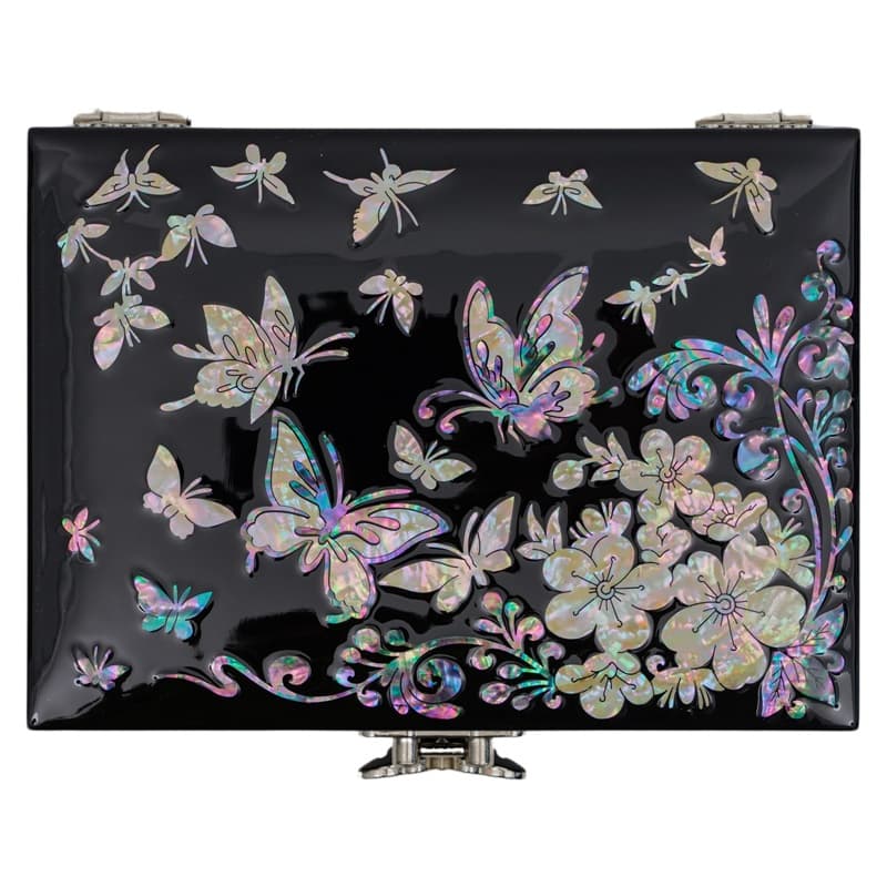 A glossy black lacquer box with a shimmering mother-of-pearl inlay of butterflies and florals, exemplifying traditional Asian decorative art.