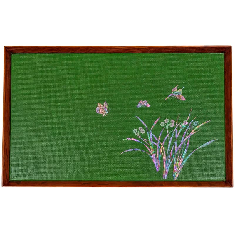 A green hemp fabric tray with a wooden frame and mother-of-pearl inlay depicting butterflies and a floral arrangement.