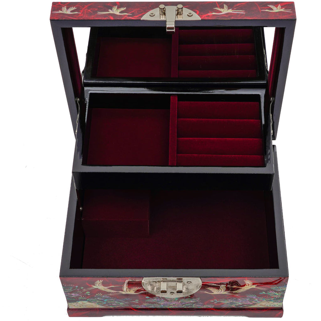 A multi-tiered jewelry box with red velvet compartments and Mother of Pearl inlay on the lid, open to display its luxurious interior.