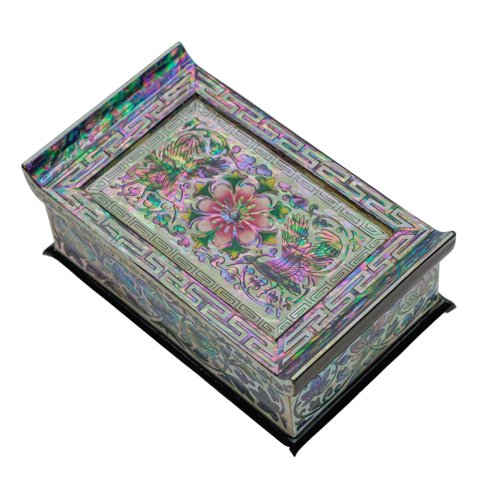 Angled view of iridescent mother-of-pearl box with cranes and floral motif