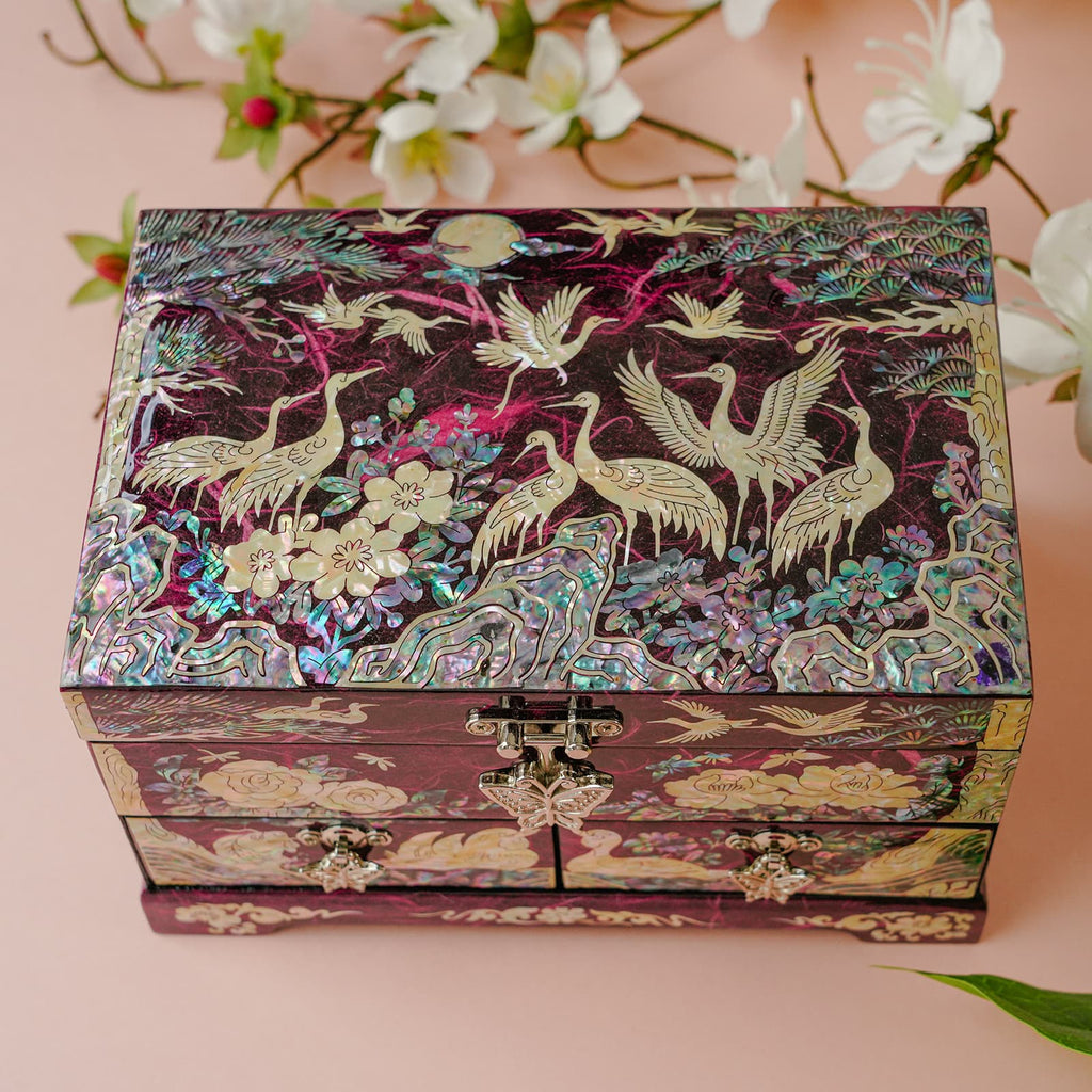 Angled jewelry box photo with floral backdrop; cranes and peonies in mother-of-pearl