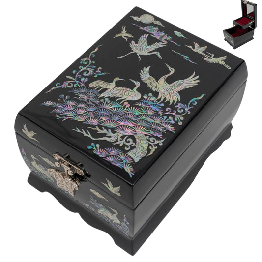 Angled view of a black jewelry box with mother-of-pearl crane art, including a thumbnail of the open red velvet interior and mirror.