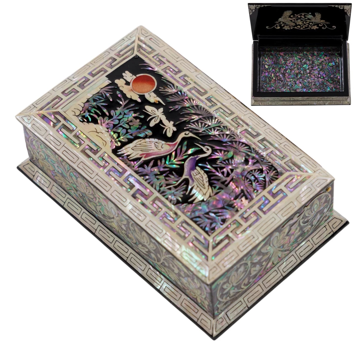 Angled view of rectangular lacquer jewelry box with mother of pearl crane and pine tree design on the lid