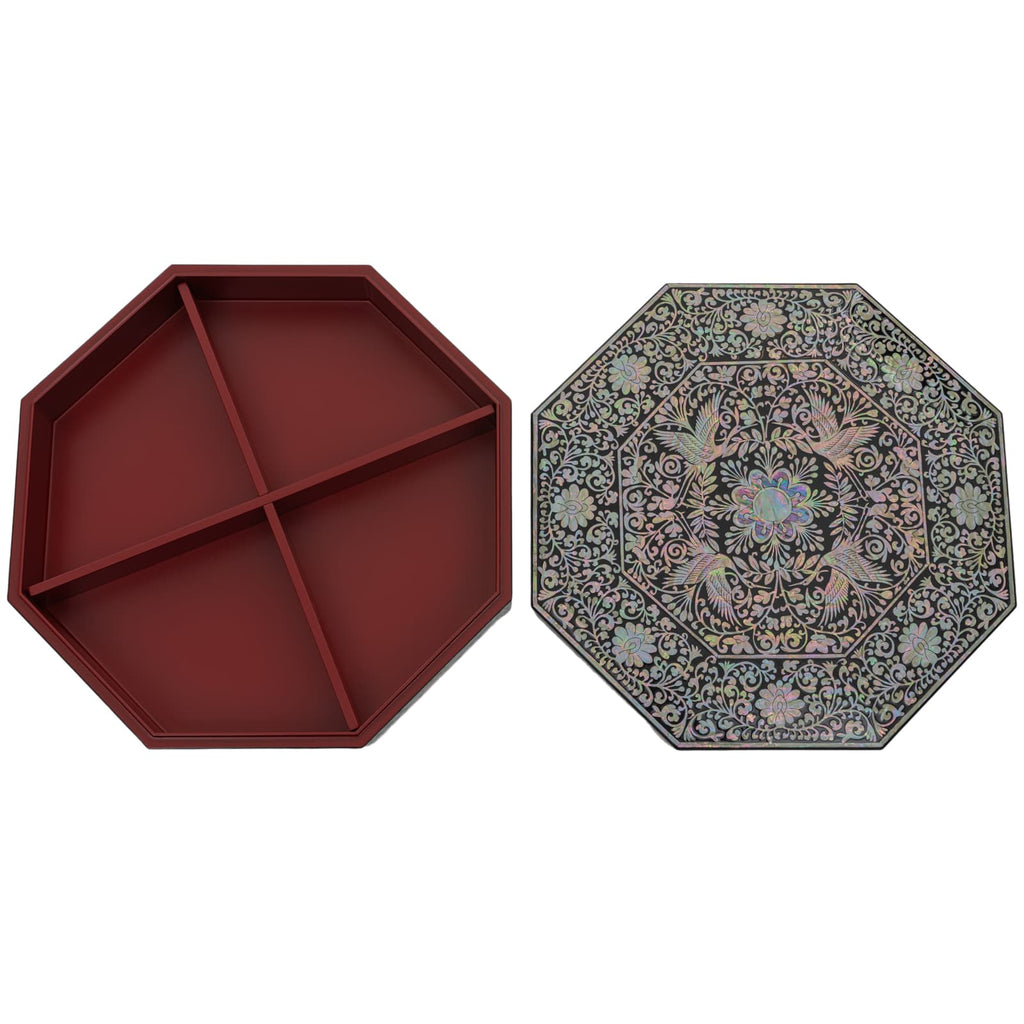 An octagonal box displayed open with a red interior and a decorative Mother of Pearl lid featuring detailed floral patterns, isolated on a white background.