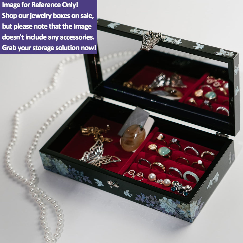 An open black jewelry box with a velvet-lined interior filled with various pieces of jewelry. Note The box is being sold without the jewelry shown.