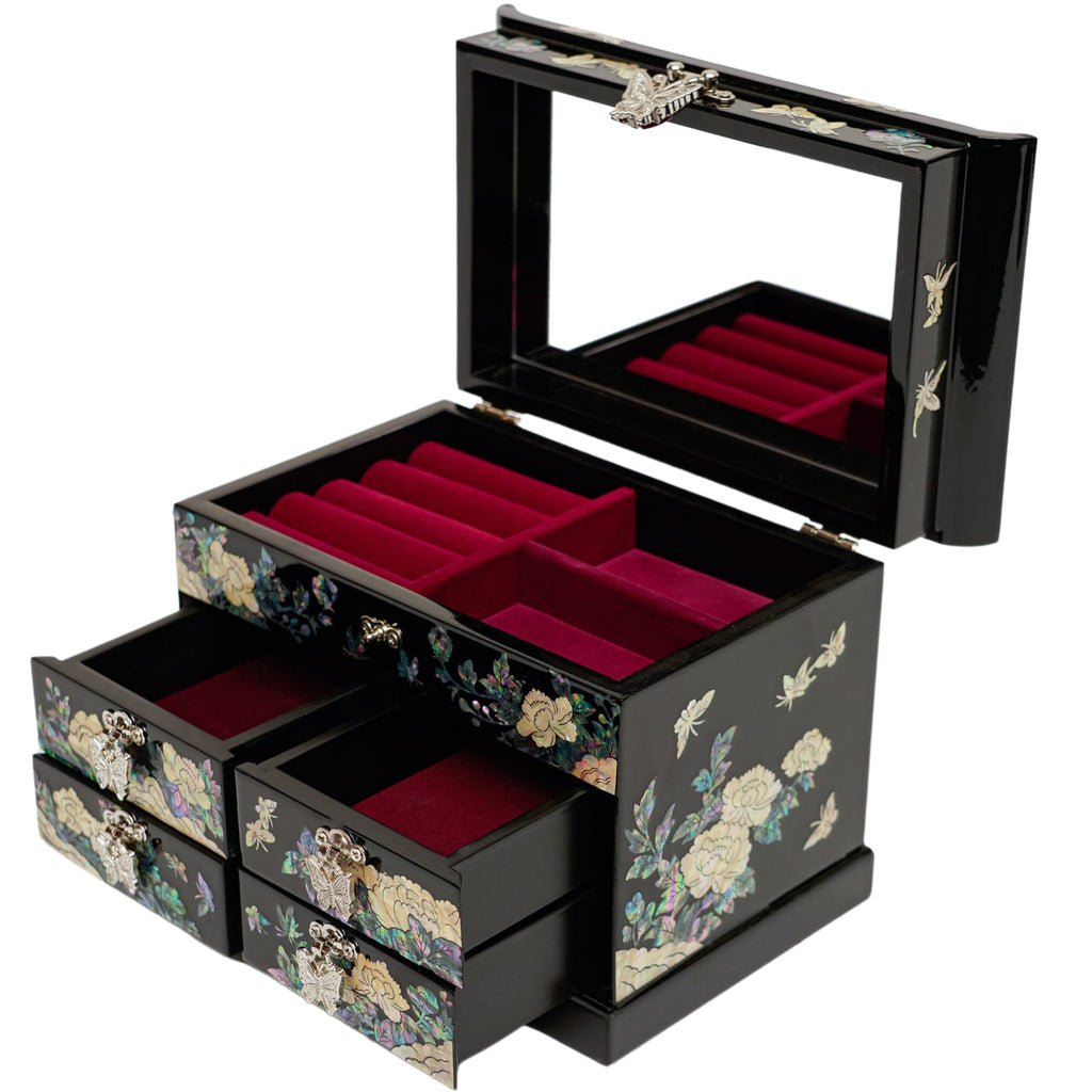 An open black jewelry box with mother-of-pearl inlay and red velvet interior.