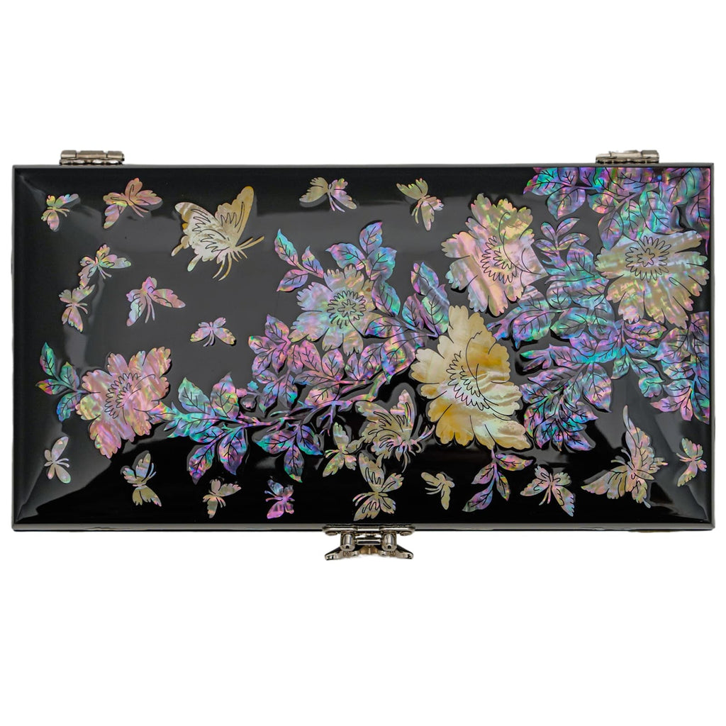 An ornate black lacquer box with a detailed mother-of-pearl floral and butterfly design on the lid, featuring a metallic clasp in the front.